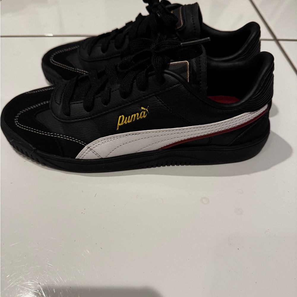 Puma Black and White Sneakers with Gold Logo
